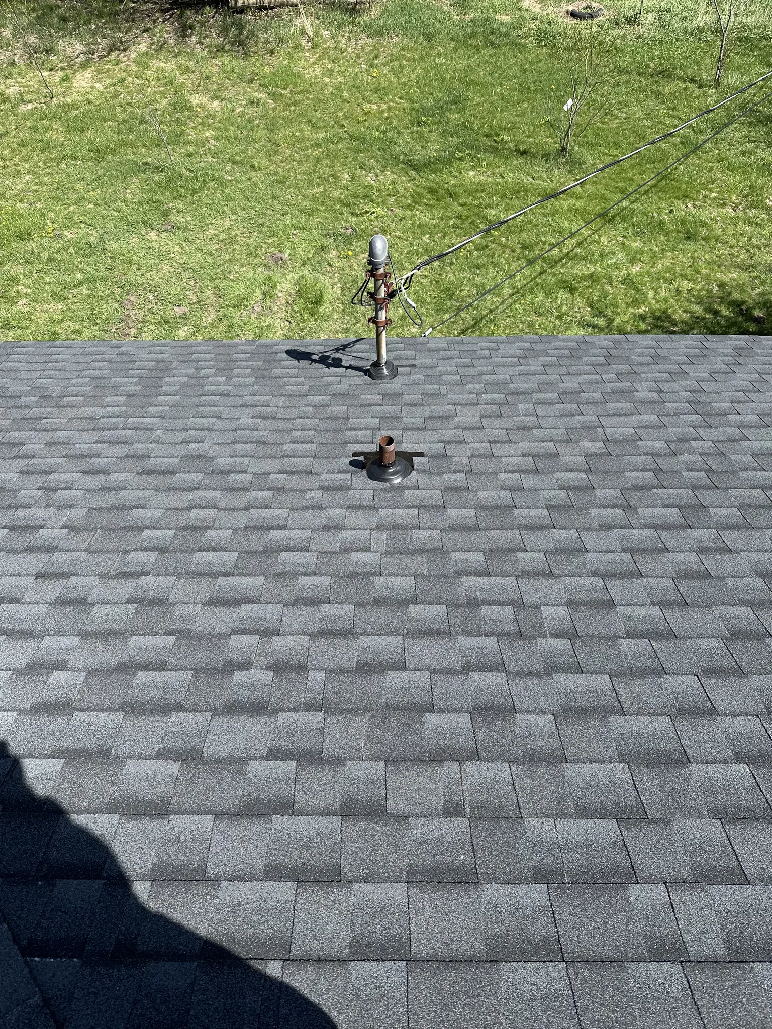 Platinum Roofing crew on completed residential roof in West Michigan