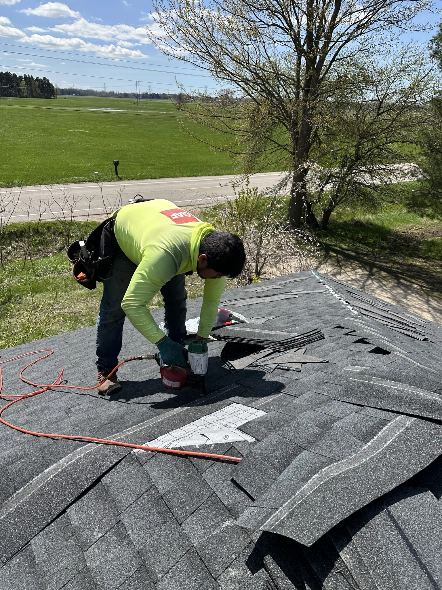 Platinum Roofing crew installing shingles on a residential roof