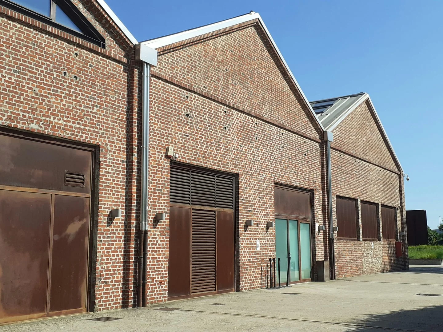 Industrial brick building with restored commercial roof